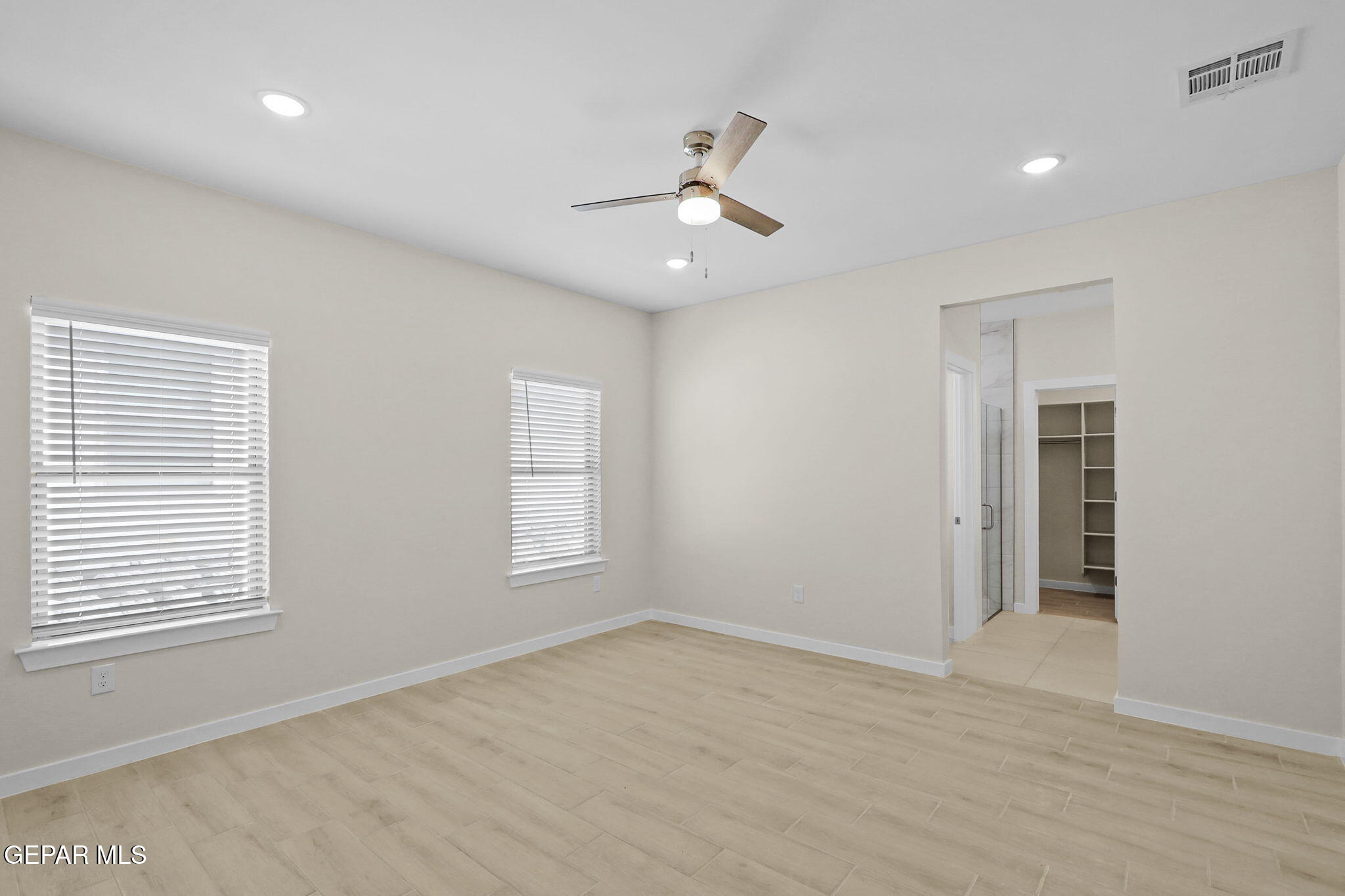 8409 Phil Place Vinton, TX 79821 - Photo 18 of 20 wooden floor in an empty room with a window