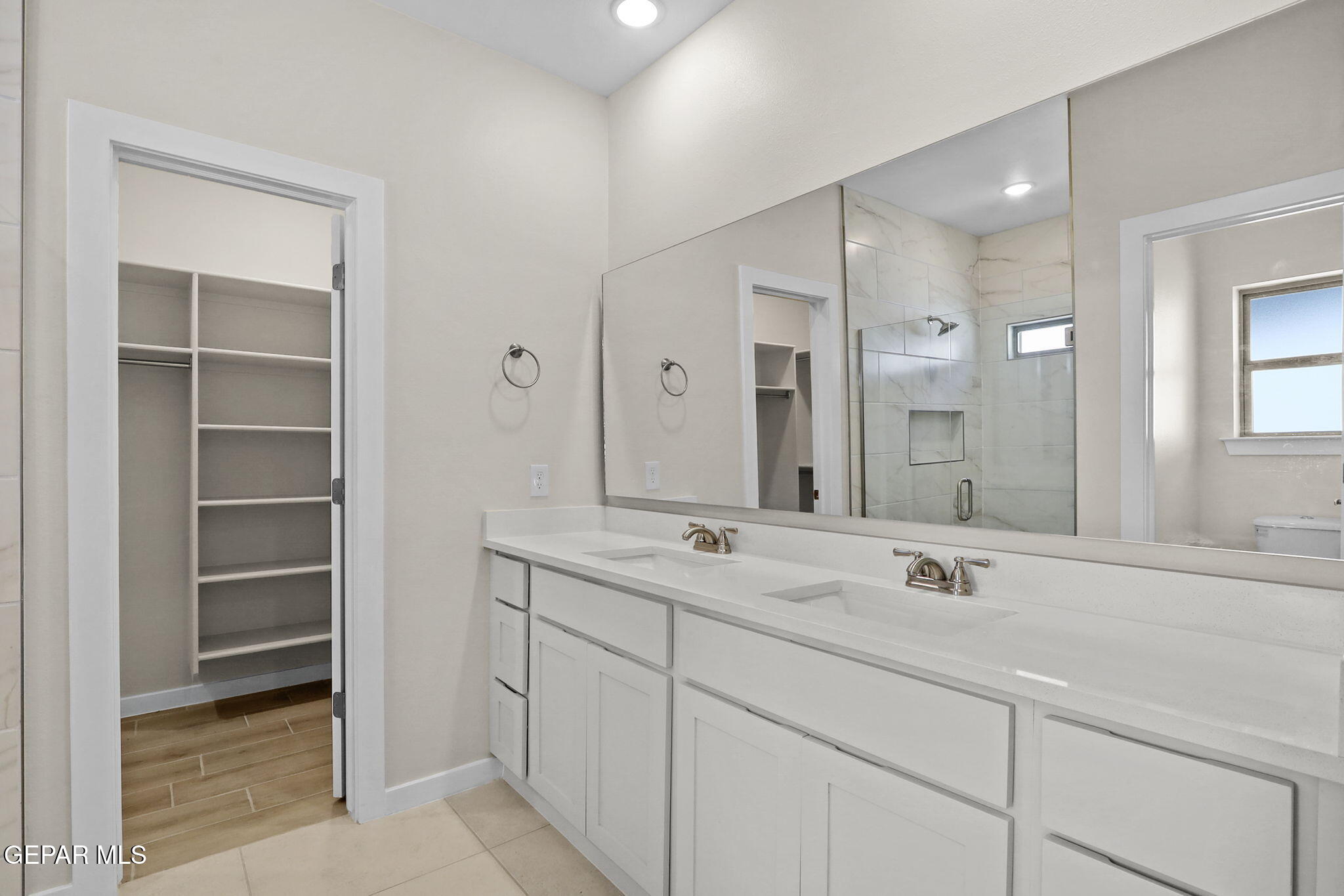 8409 Phil Place Vinton, TX 79821 - Photo 8 of 20 a bathroom with a sink and a mirror