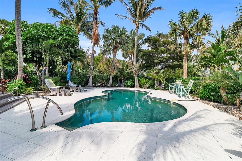 621 Casey Key Road Nokomis, FL 34275 - Photo 11 of 51 a view of a swimming pool with a patio