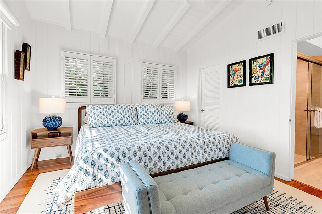 621 Casey Key Road Nokomis, FL 34275 - Photo 18 of 51 a bedroom with a bed and wooden floor