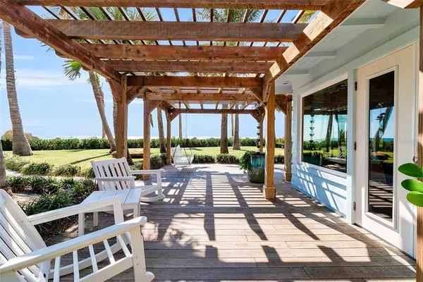 a view of a patio with a table and chairs