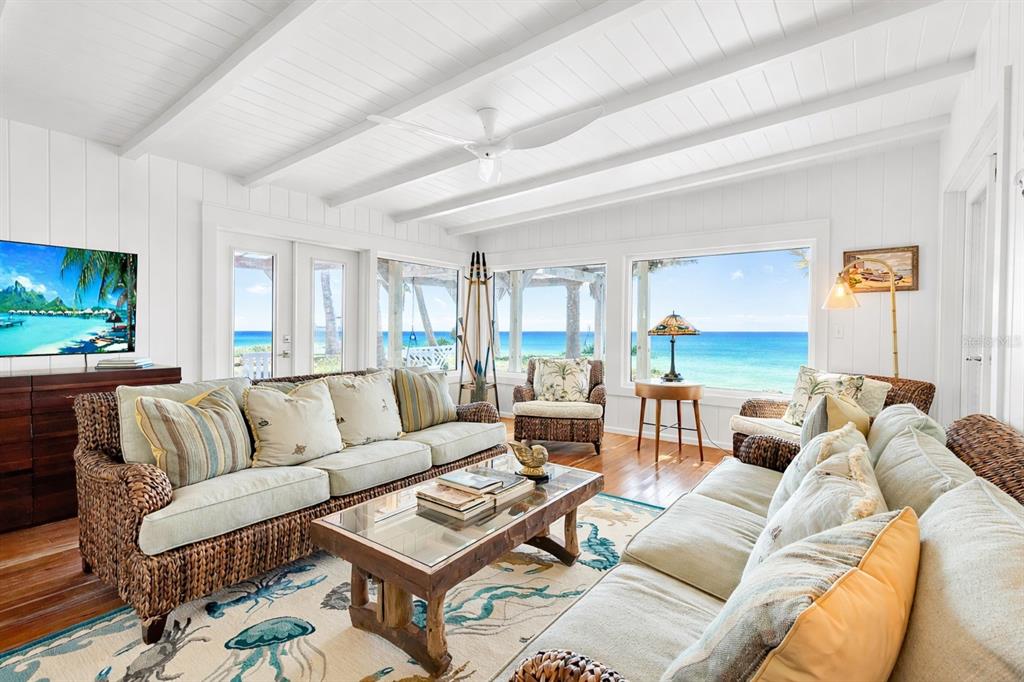 621 Casey Key Road Nokomis, FL 34275 - Photo 2 of 51 a living room with furniture and a flat screen tv