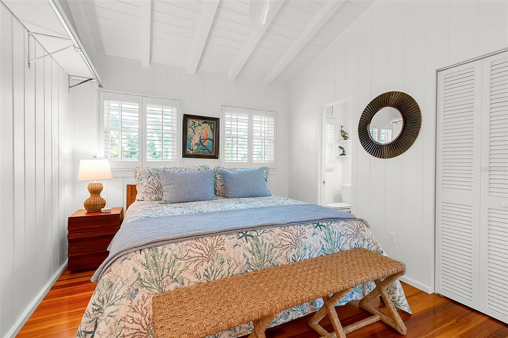 621 Casey Key Road Nokomis, FL 34275 - Photo 25 of 51 a bed sitting in a bedroom next to a window