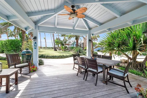 a patio with yard glass top table and chairs