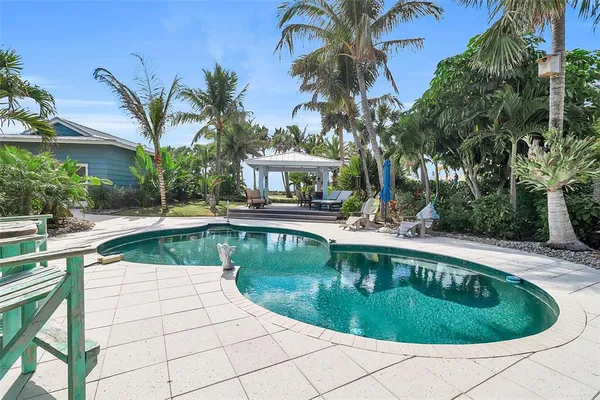 a view of a swimming pool with a patio