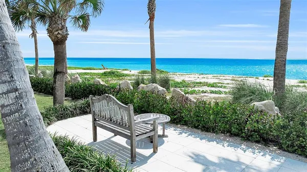 a view of a chair and tables in the garden