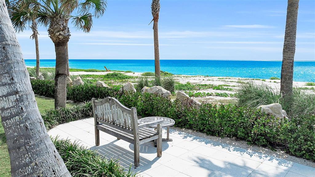 621 Casey Key Road Nokomis, FL 34275 - Photo 31 of 51 a view of a chair and tables in the garden