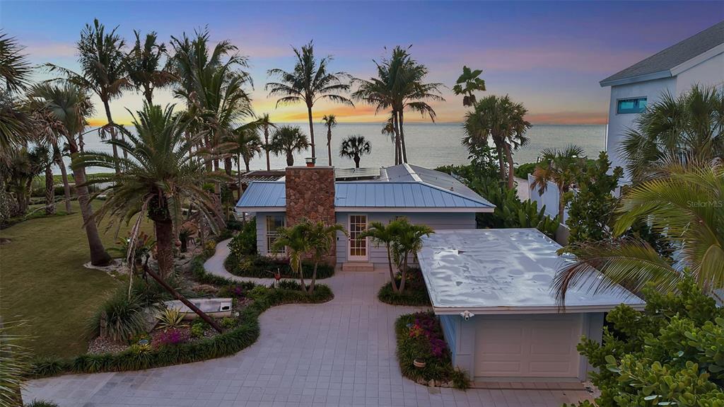 621 Casey Key Road Nokomis, FL 34275 - Photo 33 of 51 a view of a house with a patio