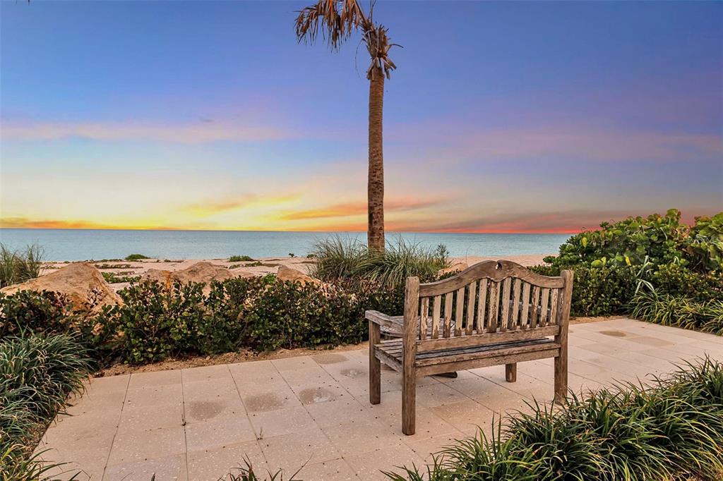 621 Casey Key Road Nokomis, FL 34275 - Photo 35 of 51 a view of a terrace with a bench