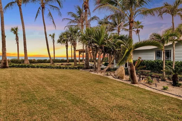 a view of a swimming pool with a table and chairs