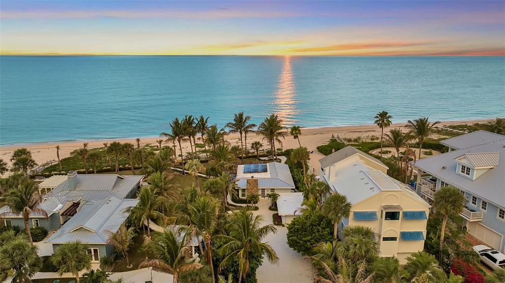 621 Casey Key Road Nokomis, FL 34275 - Photo 40 of 51 a view of a lake with a building in the background