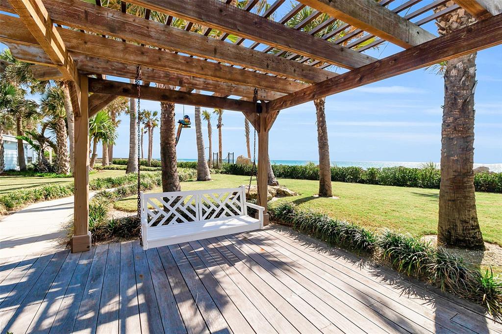 621 Casey Key Road Nokomis, FL 34275 - Photo 6 of 51 a view of a patio with wooden floor