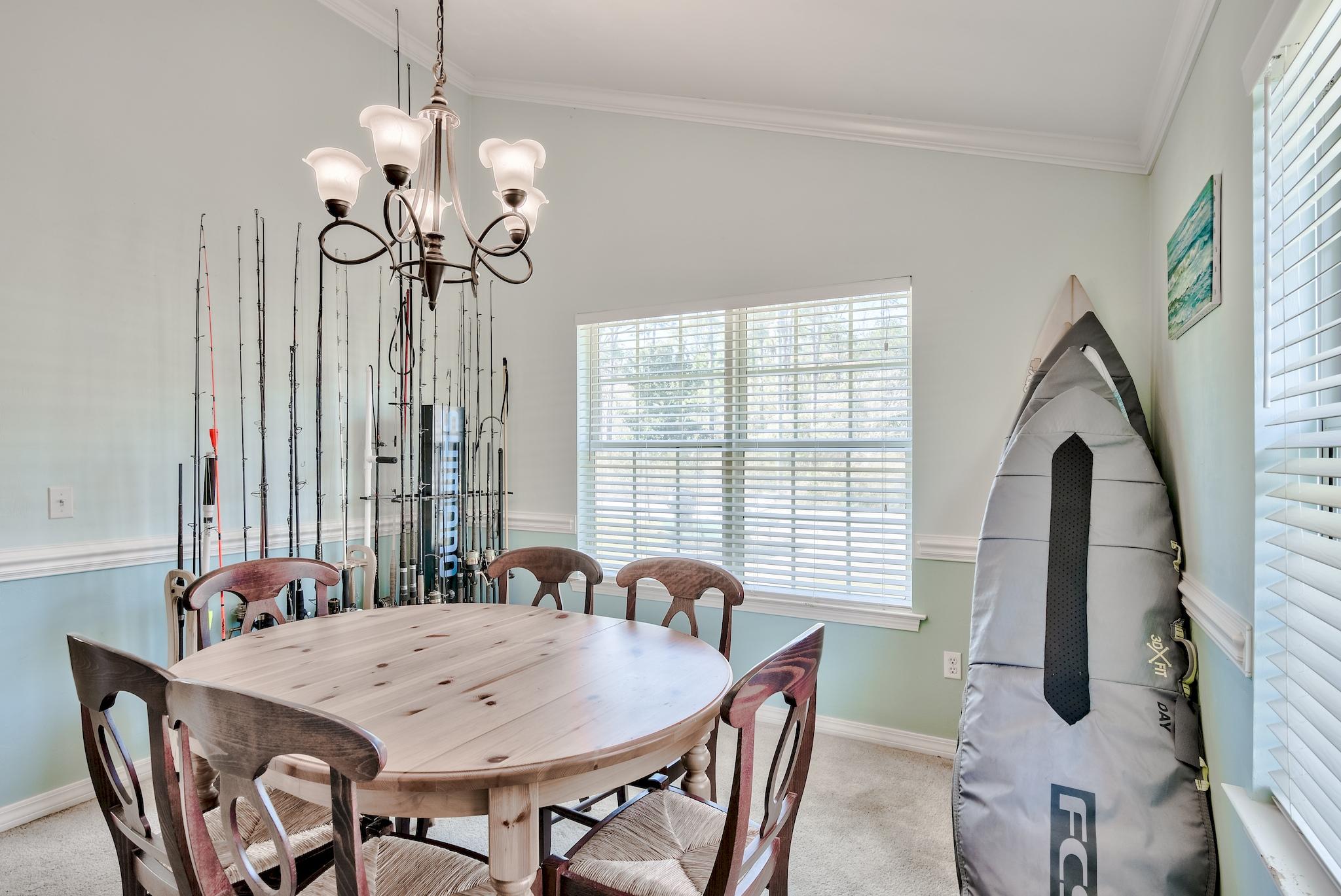 20 4th Street Santa Rosa Beach, FL 32459 - Photo 12 of 41 a view of a dining room with furniture wooden floor and chandelier