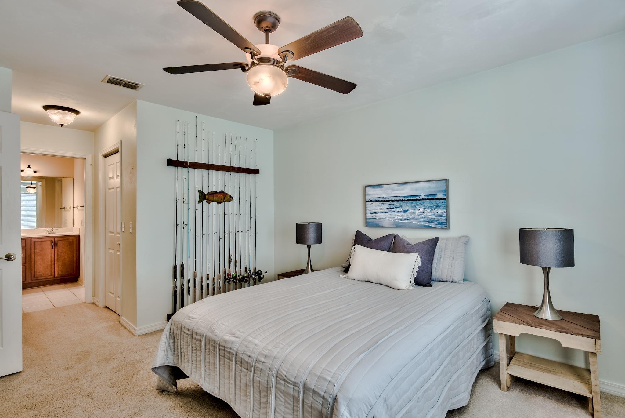 20 4th Street Santa Rosa Beach, FL 32459 - Photo 15 of 41 a bedroom with a bed and a lamp