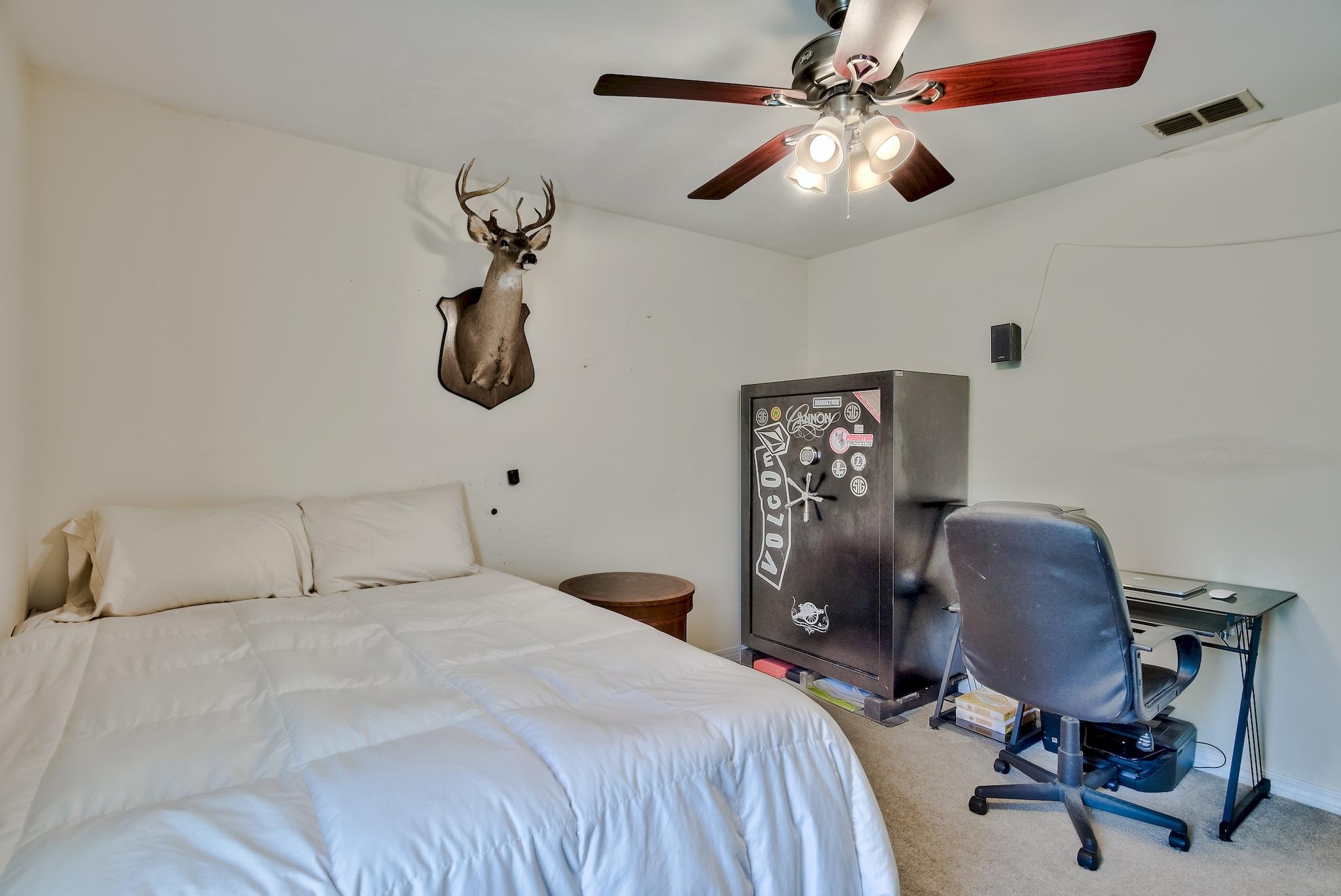 20 4th Street Santa Rosa Beach, FL 32459 - Photo 18 of 41 a bedroom with a bed and a chandelier