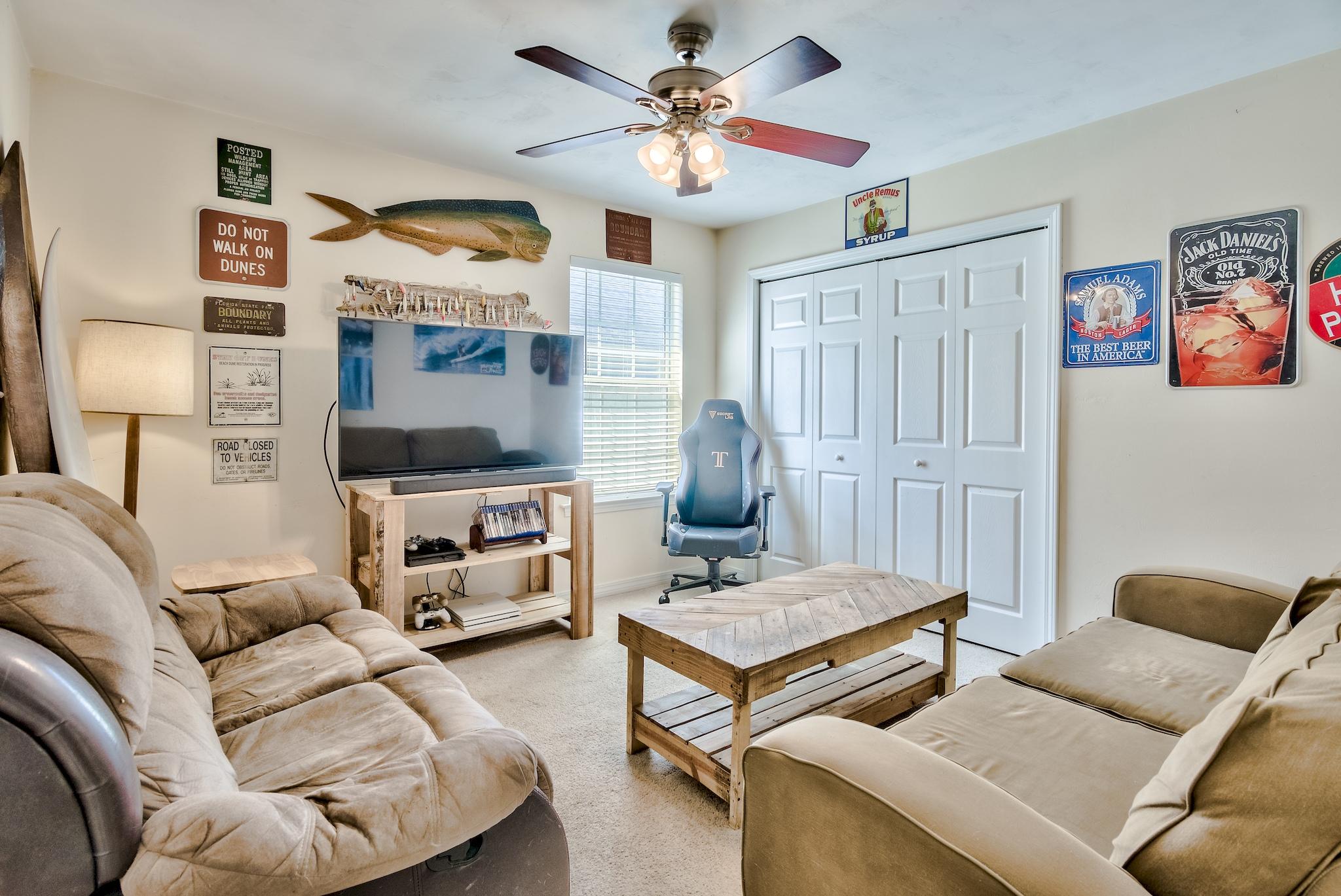 20 4th Street Santa Rosa Beach, FL 32459 - Photo 20 of 41 a living room with furniture and a chandelier