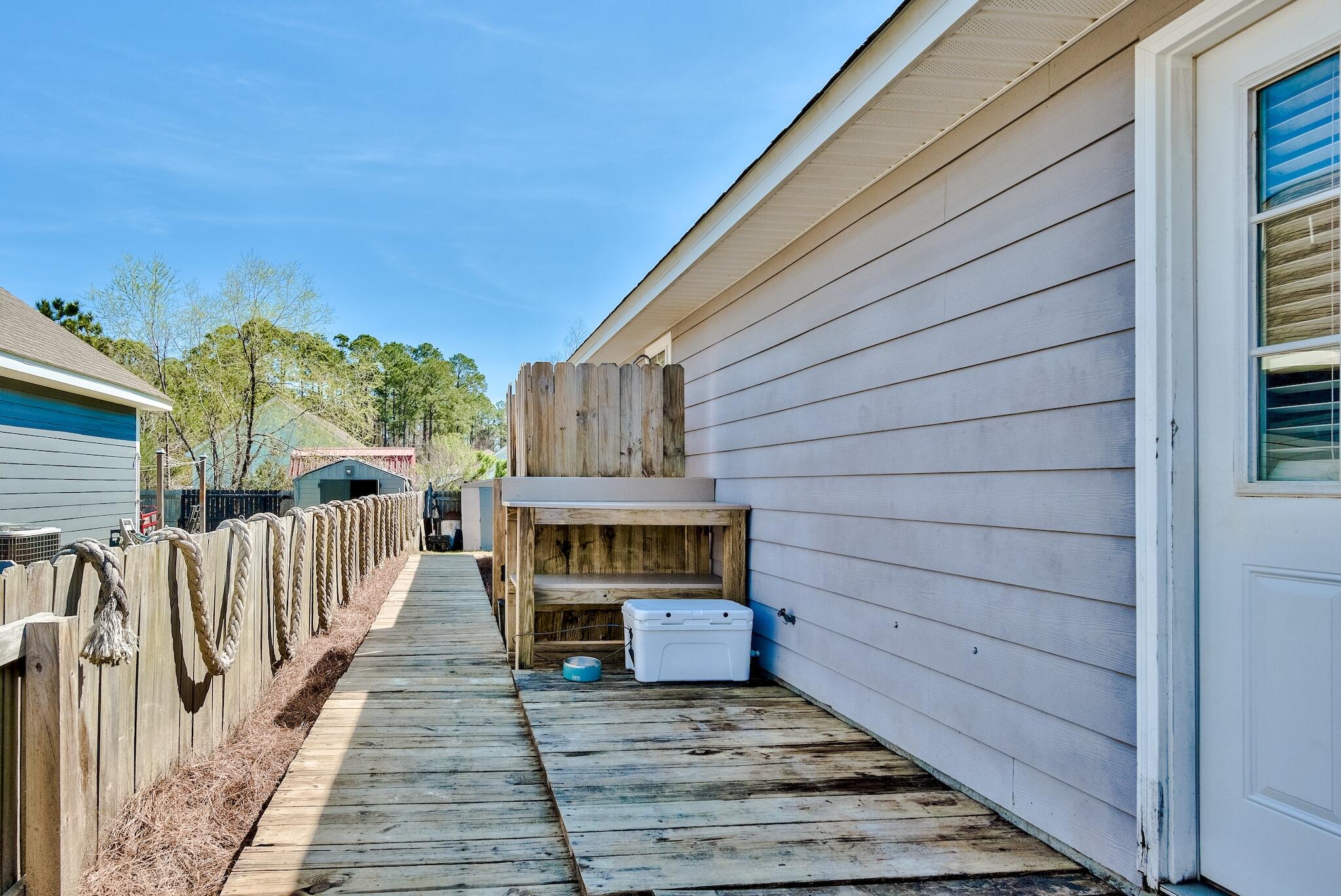 20 4th Street Santa Rosa Beach, FL 32459 - Photo 21 of 41 a view of backyard with deck and outdoor seating