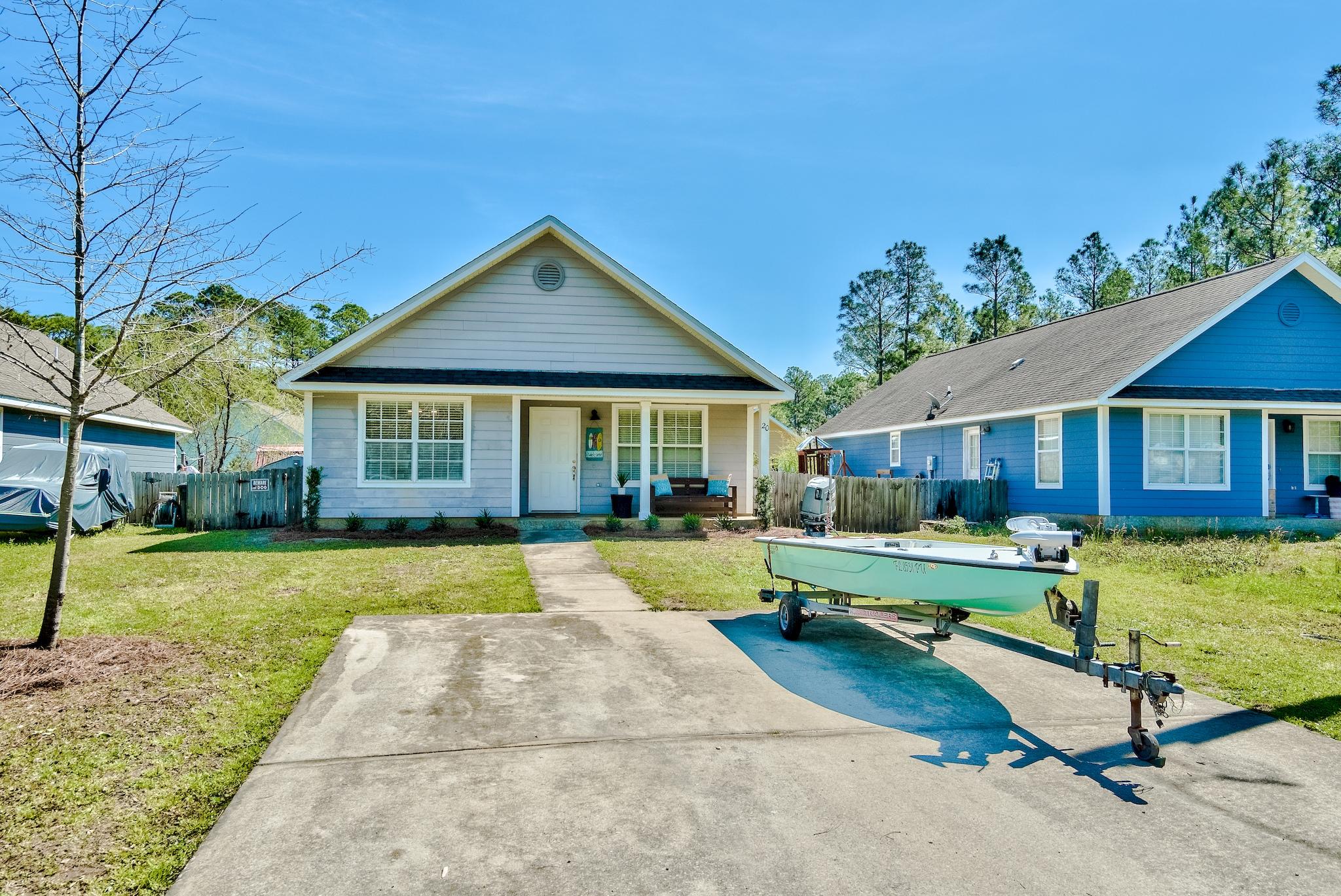20 4th Street Santa Rosa Beach, FL 32459 - Photo 24 of 41 a front view of a house with swimming pool having outdoor seating