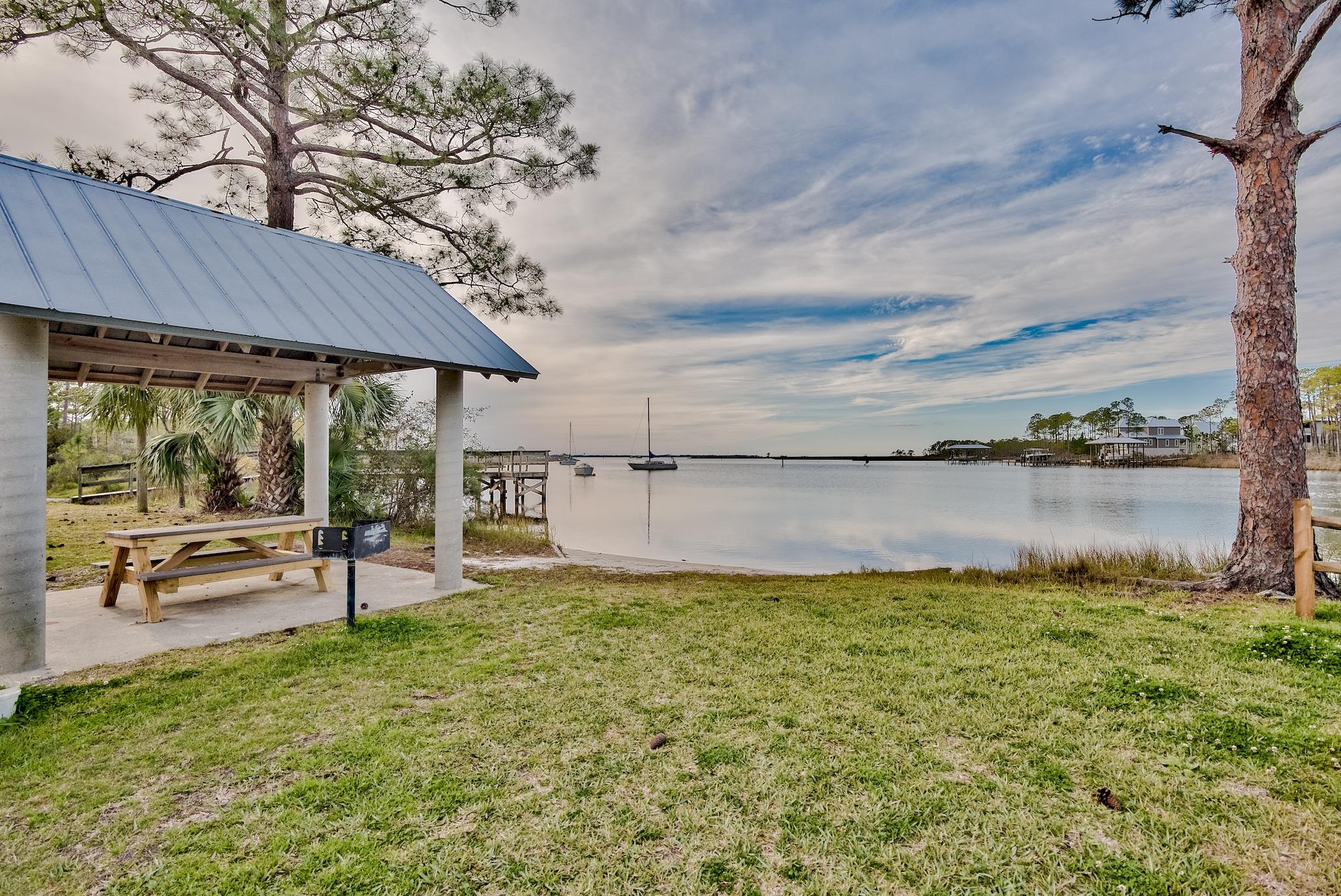 20 4th Street Santa Rosa Beach, FL 32459 - Photo 28 of 41 a swimming pool with outdoor seating and yard