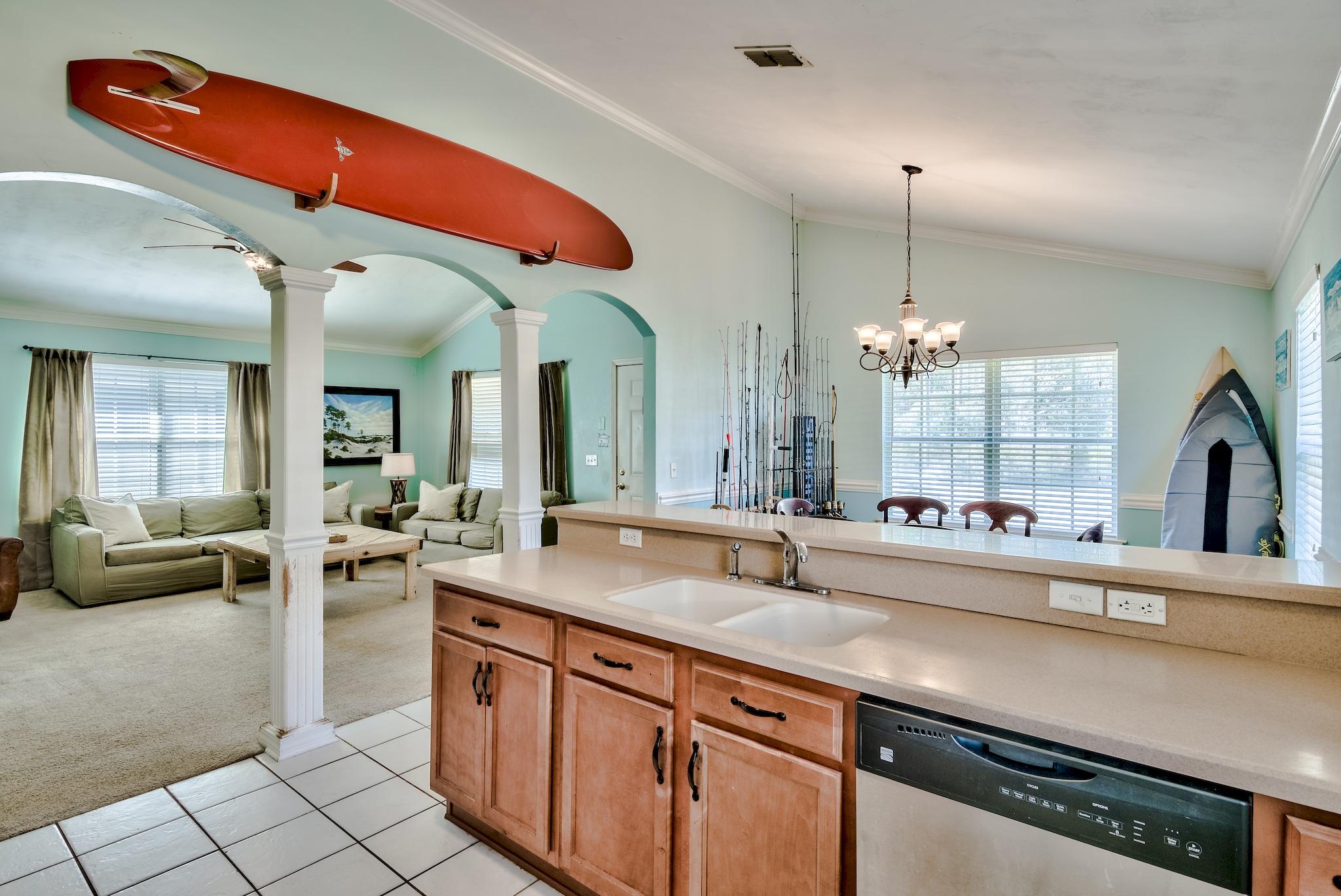 20 4th Street Santa Rosa Beach, FL 32459 - Photo 9 of 41 a large kitchen with kitchen island a large counter space a sink stainless steel appliances and cabinets