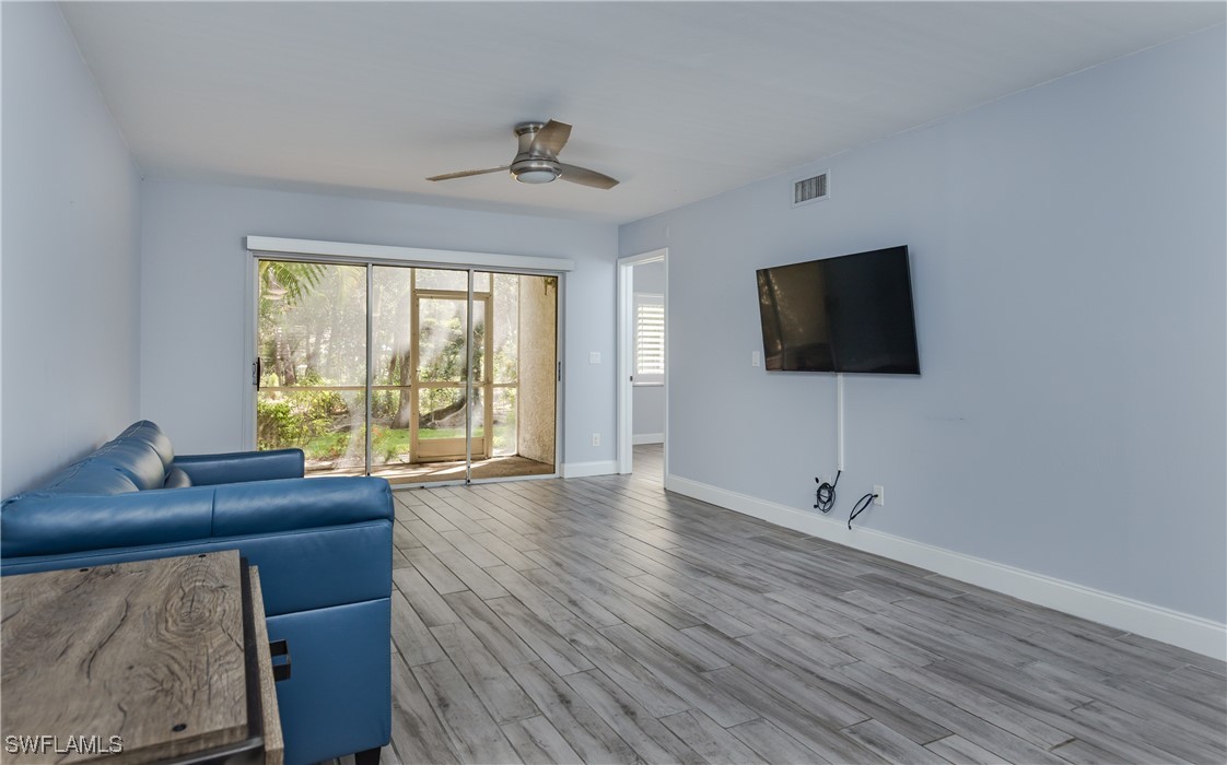 3451 County Barn Road, Unit G103 Naples, FL 34112 - Photo 13 of 25 a view of a livingroom with workspace and a window