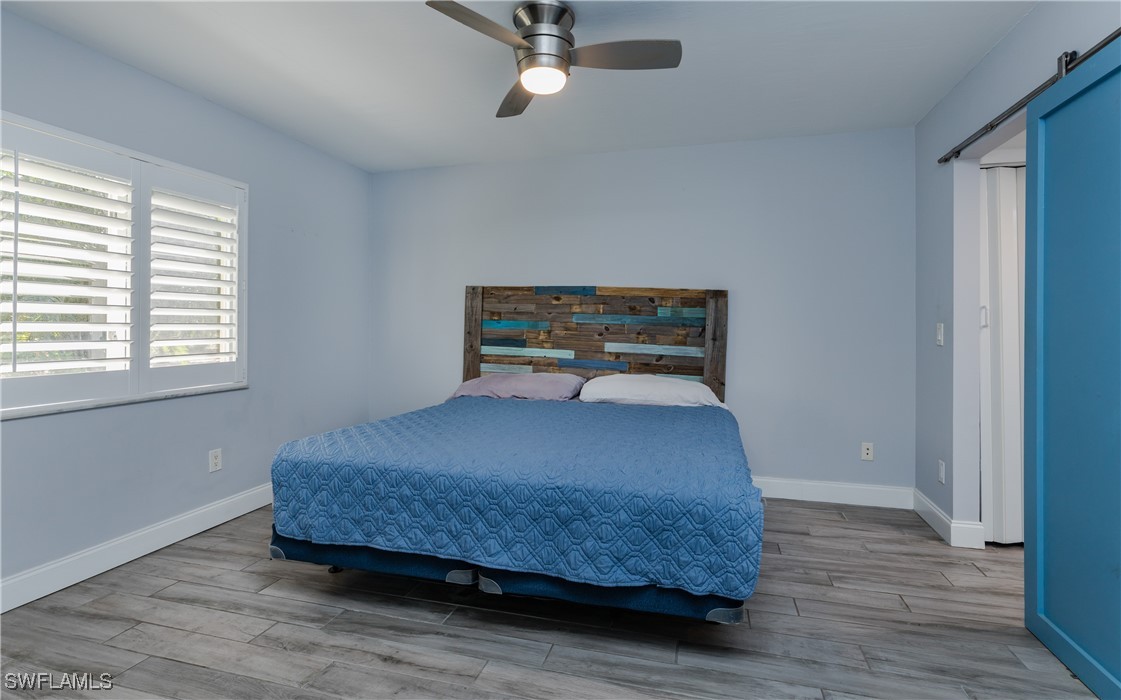 3451 County Barn Road, Unit G103 Naples, FL 34112 - Photo 14 of 25 a bedroom with a bed and window