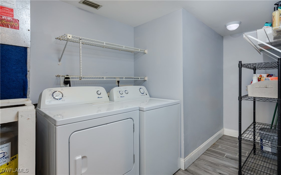 3451 County Barn Road, Unit G103 Naples, FL 34112 - Photo 19 of 25 a utility room with dryer and washer
