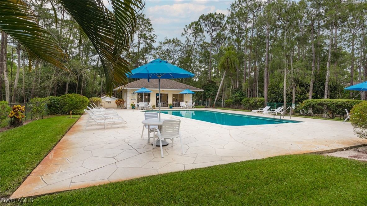 3451 County Barn Road, Unit G103 Naples, FL 34112 - Photo 23 of 25 a view of a house with a yard