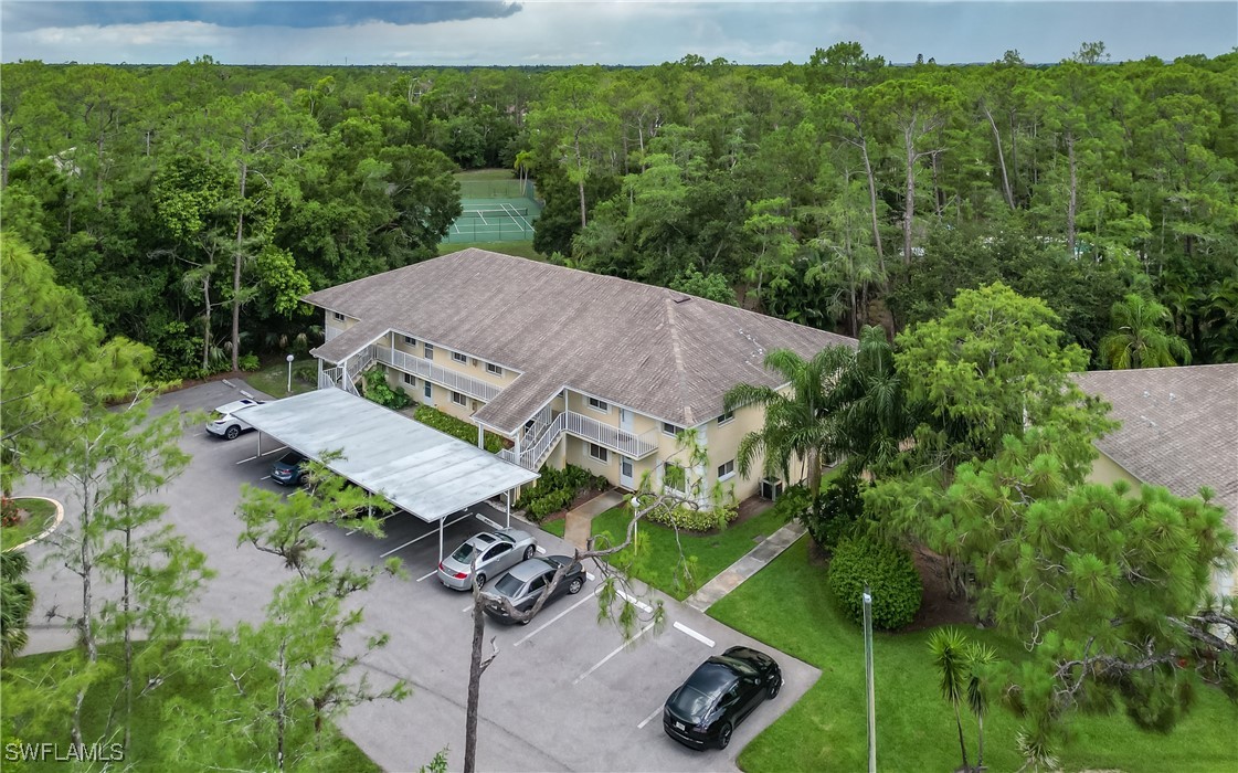3451 County Barn Road, Unit G103 Naples, FL 34112 - Photo 5 of 25 an aerial view of a house with pool yard and outdoor seating