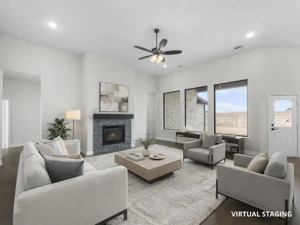 a living room with furniture and a fireplace