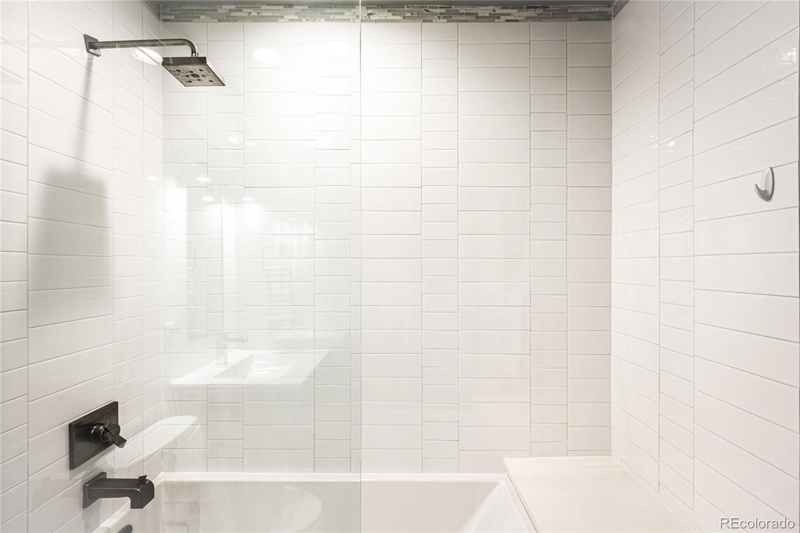790 Clayton Street Denver, CO 80206 - Photo 15 of 32 a bathroom with a shower