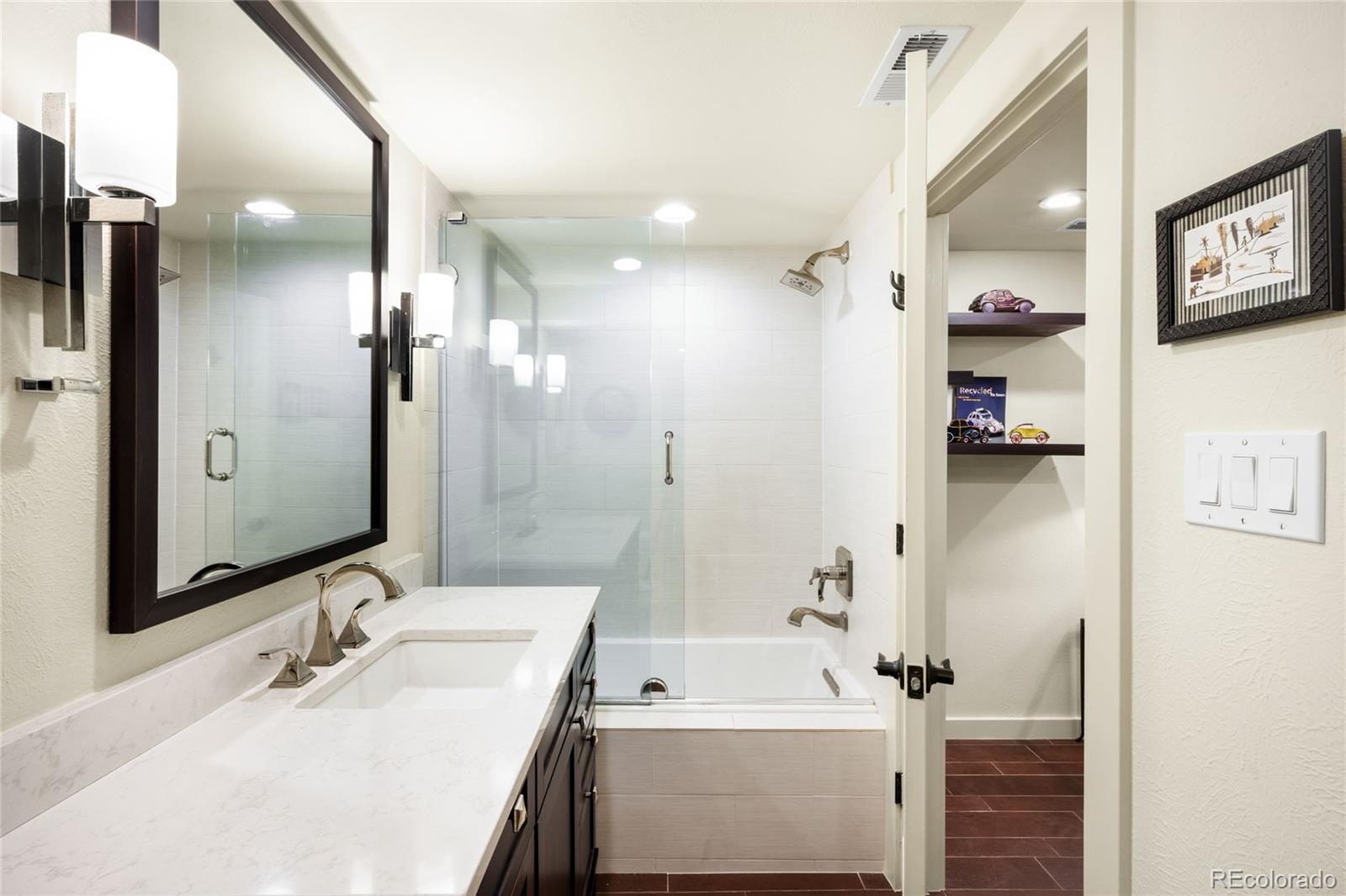 790 Clayton Street Denver, CO 80206 - Photo 24 of 32 a bathroom with a sink a toilet and shower