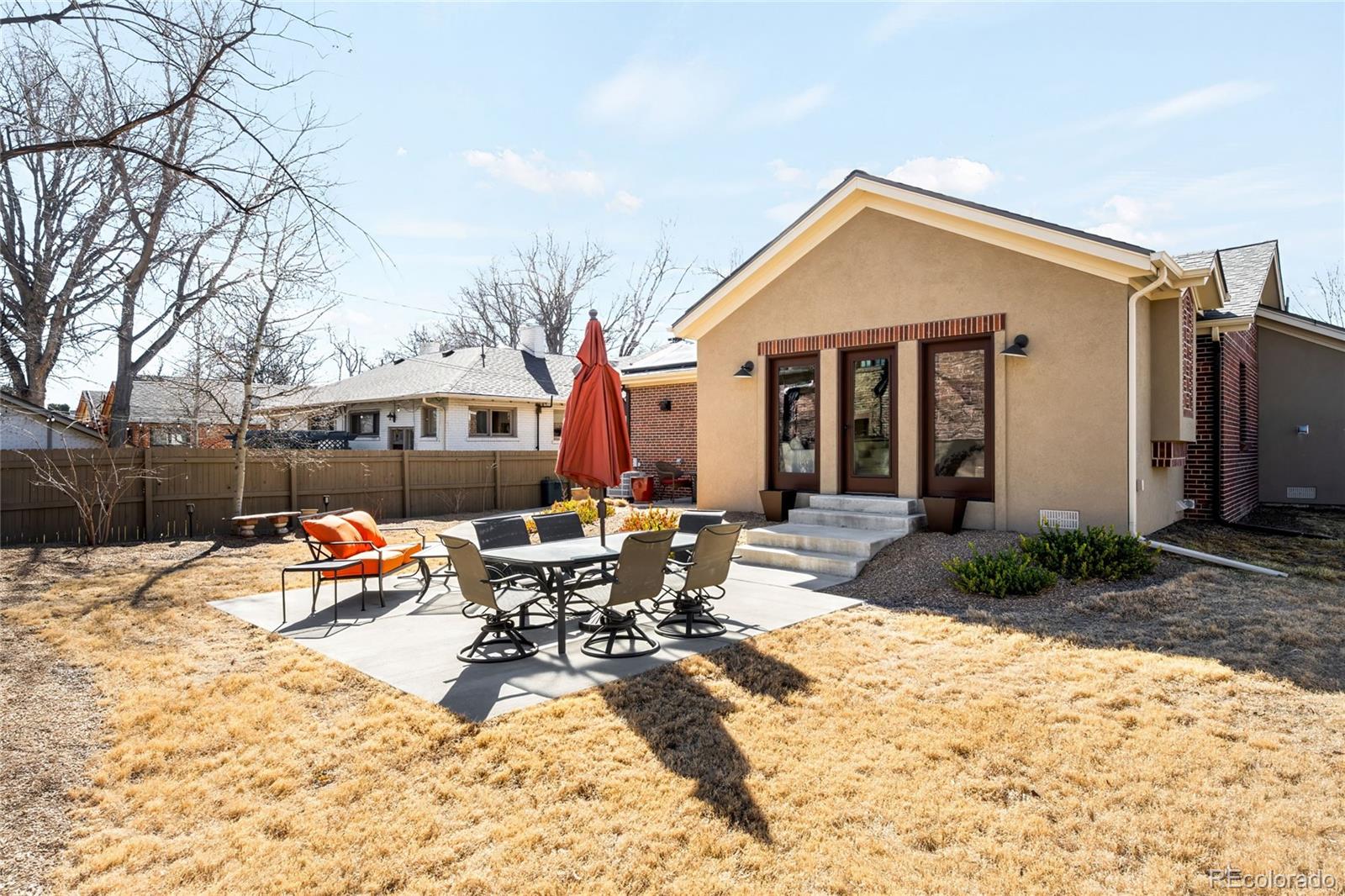790 Clayton Street Denver, CO 80206 - Photo 28 of 32 a wooden bench sitting in front of house