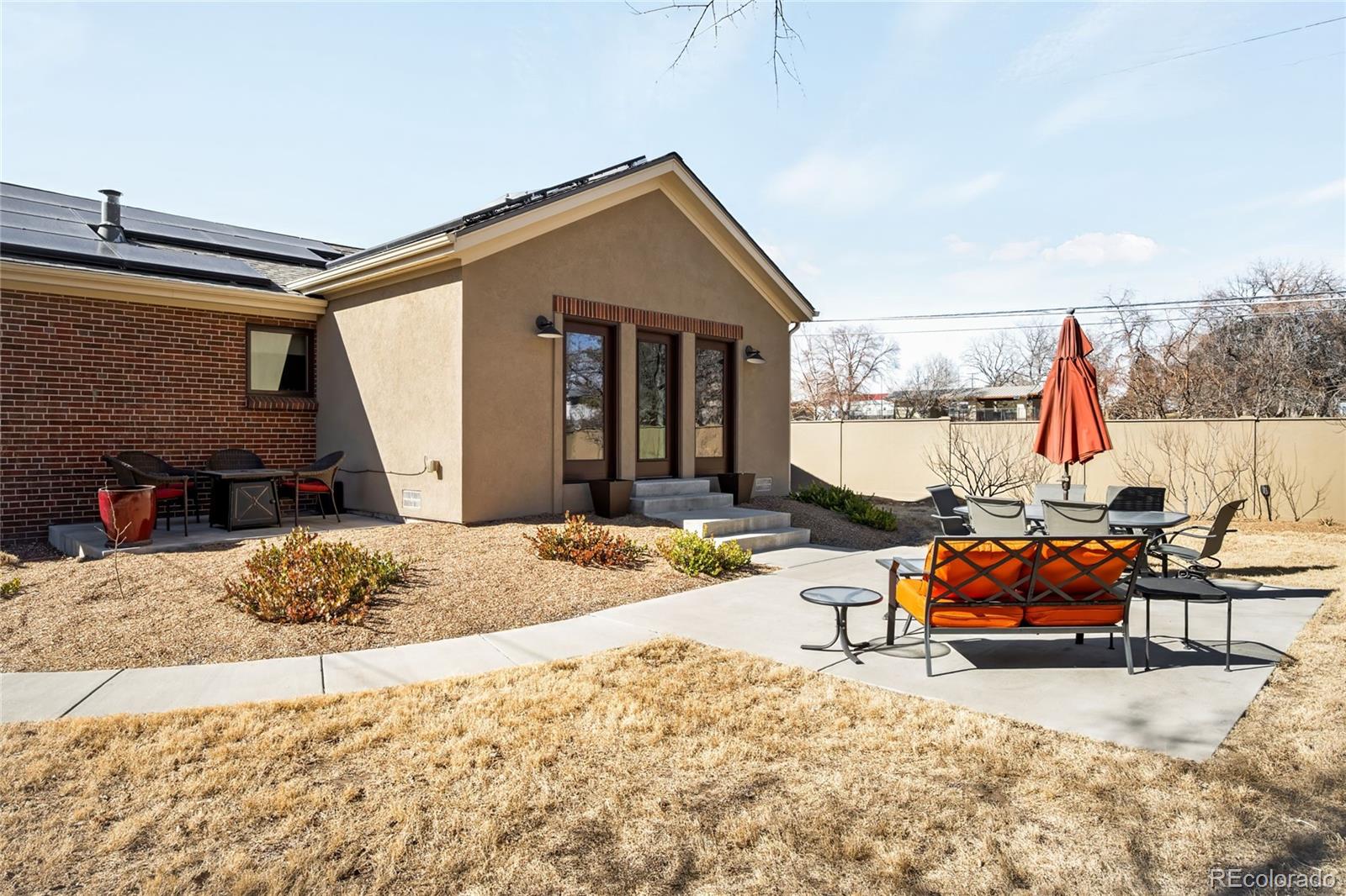 790 Clayton Street Denver, CO 80206 - Photo 29 of 32 a outdoor space view with a couch and potted plants