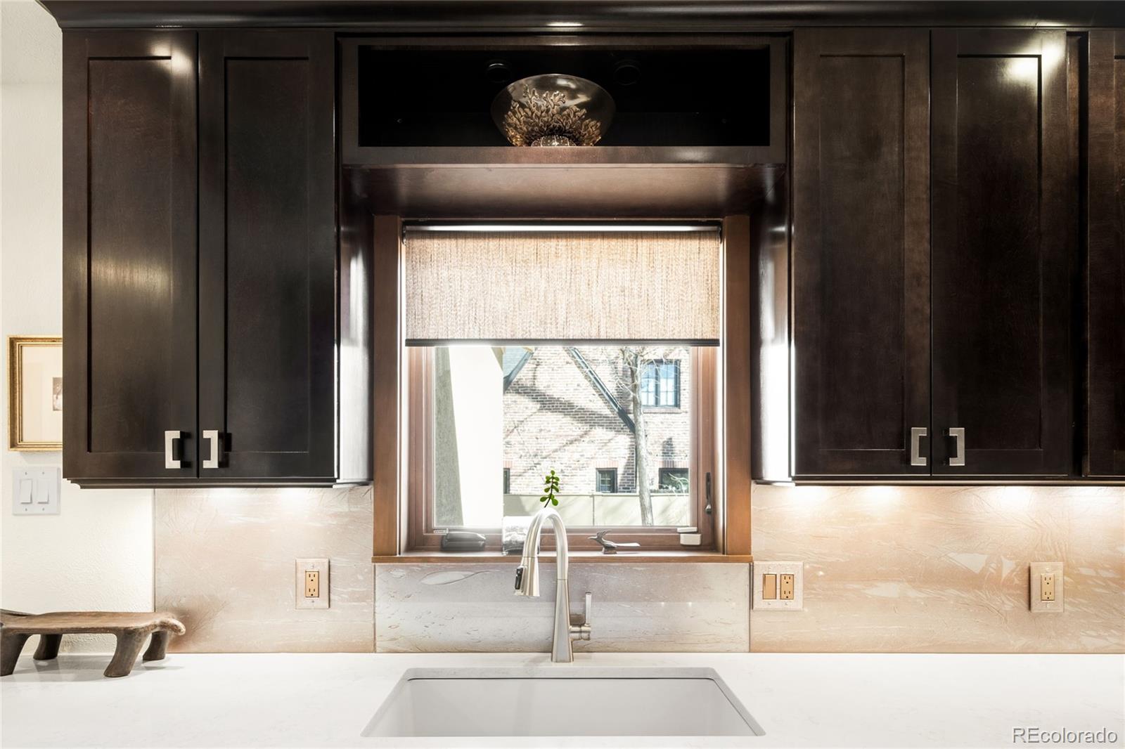 790 Clayton Street Denver, CO 80206 - Photo 7 of 32 a bathroom with a sink and a mirror