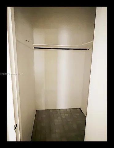 a view of walk in closet with window