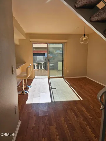 an entryway with wooden floor