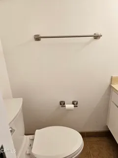 a bathroom with a toilet and a sink