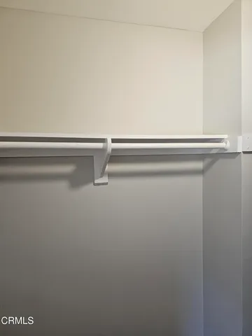 a view of a patio with table and chairs and potted plants