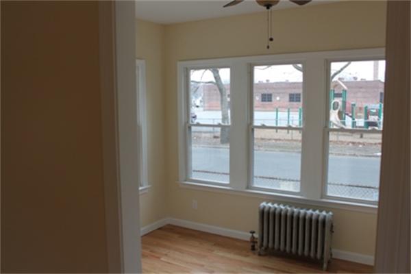 55 Alvin Street Springfield, MA 01104 - Photo 17 of 23 a view of an empty room with a window