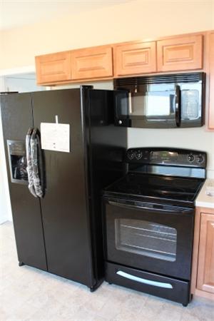 55 Alvin Street Springfield, MA 01104 - Photo 23 of 23 a stove top oven sitting inside of a kitchen