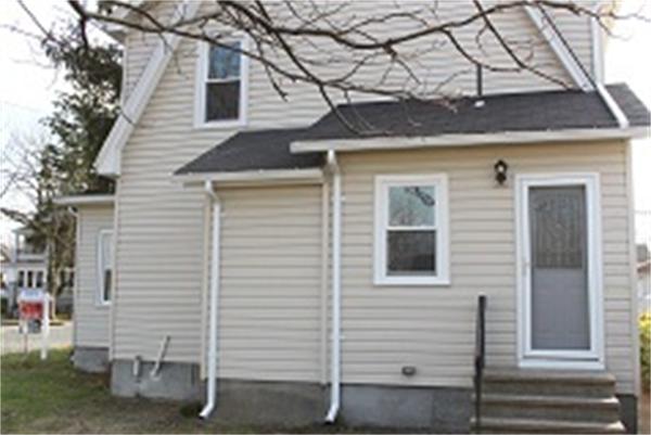55 Alvin Street Springfield, MA 01104 - Photo 3 of 23 a view of a house with a door and wooden fence