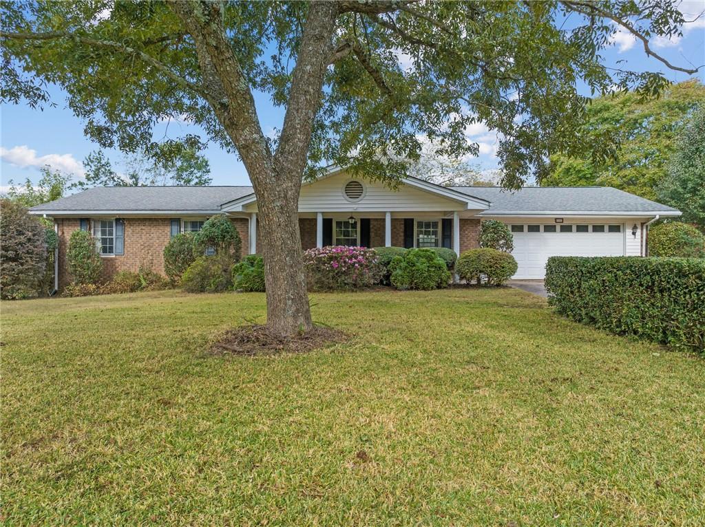 5342 McEver Road Oakwood, GA 30566 - Photo 1 of 1 a front view of house with yard and green space