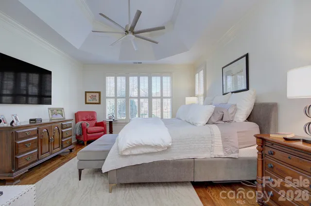 a bathroom with a sink a bathtub and next to a window