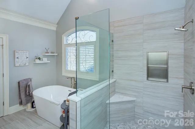 a bathroom with a sink vanity and mirror