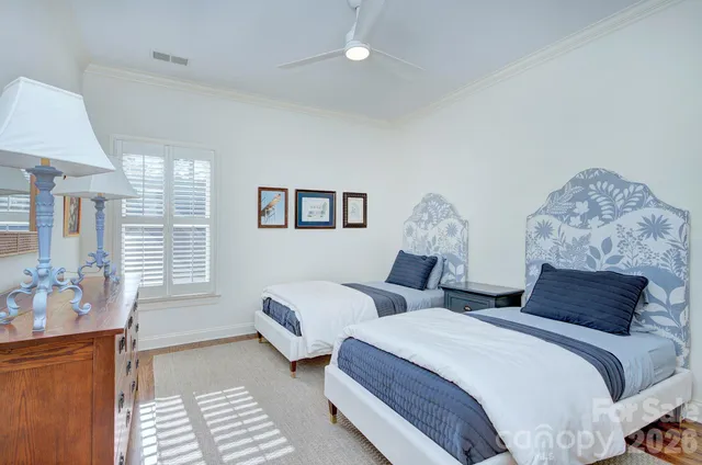 a bathroom with a granite countertop toilet sink and mirror