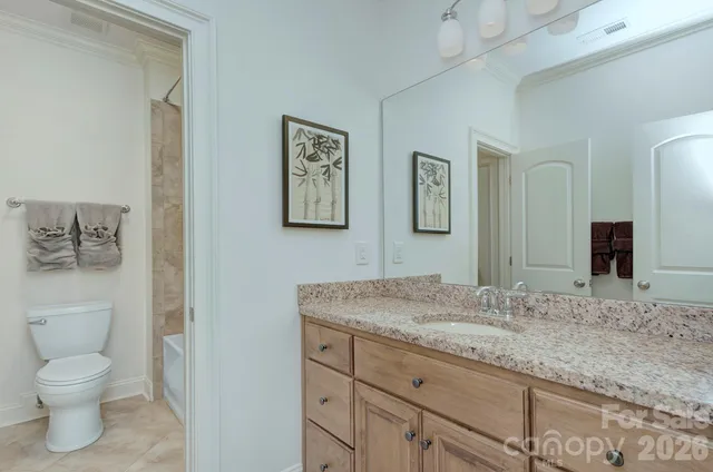 a bath tub sitting next to a bathroom sink