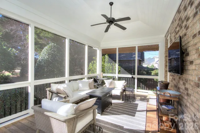 a view of backyard of house with outdoor seating
