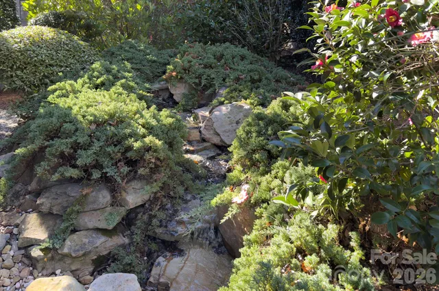 a view of a patio with table and chairs under an umbrella