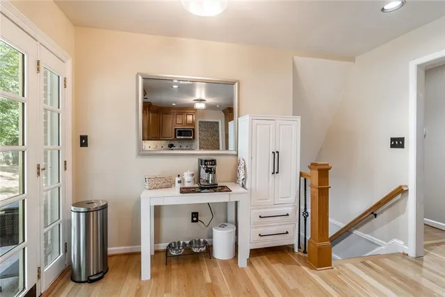 a view of a workspace with wooden floor and bedroom view